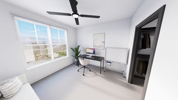A room with a ceiling fan, a bed, and a window overlooking the beach. at The Logan Luxury Apartments, Idaho